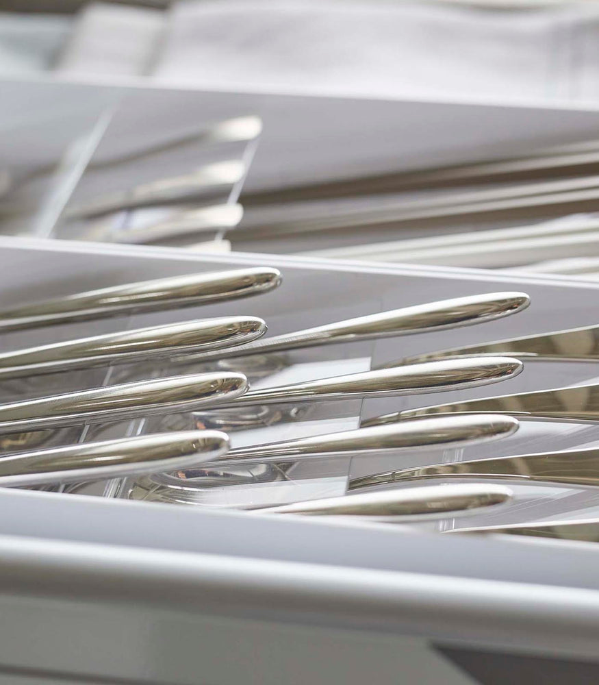 View 3 - Close up view of white Cutlery Storage Organizer holding silverware by Yamazaki Home.