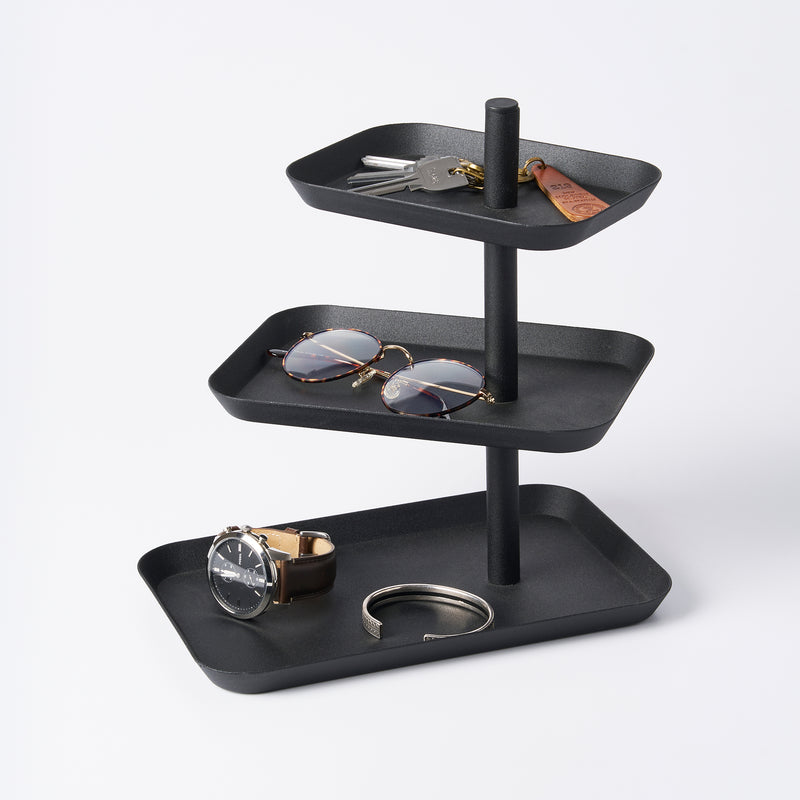 Yamazaki Home Three-Tier Accessory Tray with props, set against a white background.