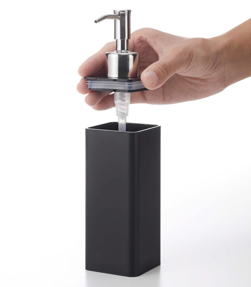 View 13 - Removing lid from black Yamazaki Home square soap dispenser