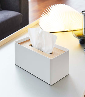 White Tissue Case next to book light on coffee table by Yamazaki Home. view 15