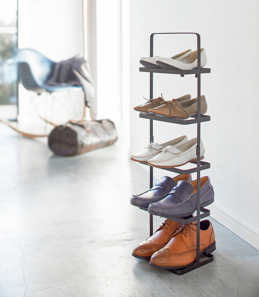 View 20 - Black Shoe Rack holding shoes in bedroom by Yamazaki home.