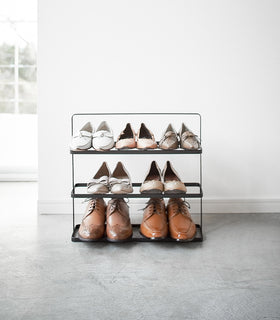 Front view of black Shoe Rack in entryway by Yamazaki home. view 10