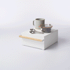 GIF of Countertop Rack with Drawer organizing kitchen items against a white background.
