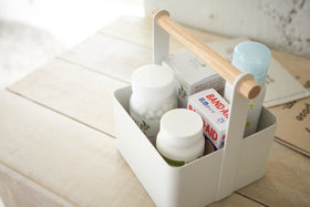 Aerial view of white Storage Caddy holding first-aid items by Yamazaki Home. view 11