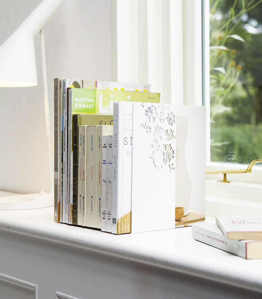 View 6 - White Bookends displaying books on windowsill by Yamazaki Home.