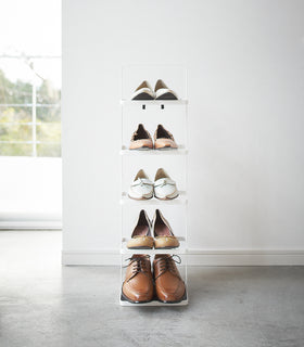 Front view of white entryway Shoe Rack holding shoes by Yamazaki home. view 7