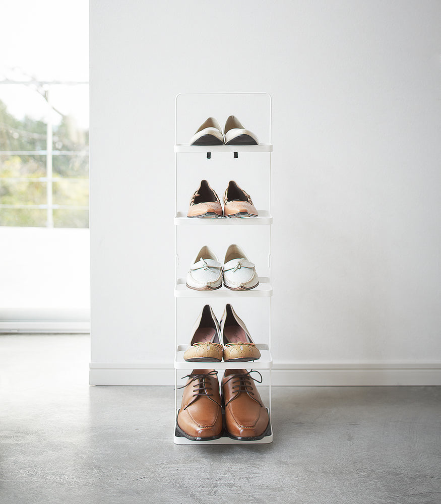 View 13 - Front view of white entryway Shoe Rack holding shoes by Yamazaki home.