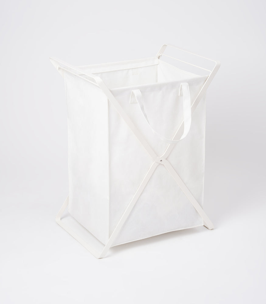 View 18 - Side view of large Laundry Hamper with Cotton Liner by Yamazaki Home in white on a white background.