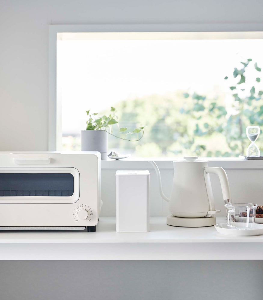 View 6 - Frontal view of white Yamazaki Home coffee storage countainer on countertop