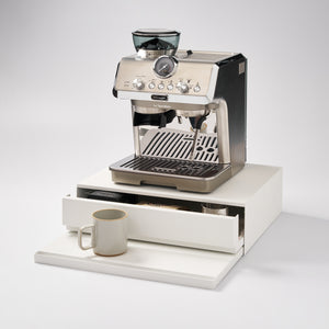Yamazaki Home Countertop Drawer with Pull-Out Shelf White with props, set against a white background.