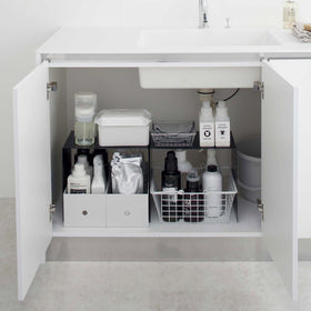 Yamazaki Black Under-Cabinet Storage Shelves holding bathroom essentials. view 11