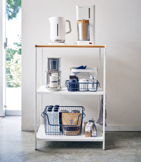 Front view of white Storage Rack holding coffee accessories and equipment by Yamazaki Home. view 2