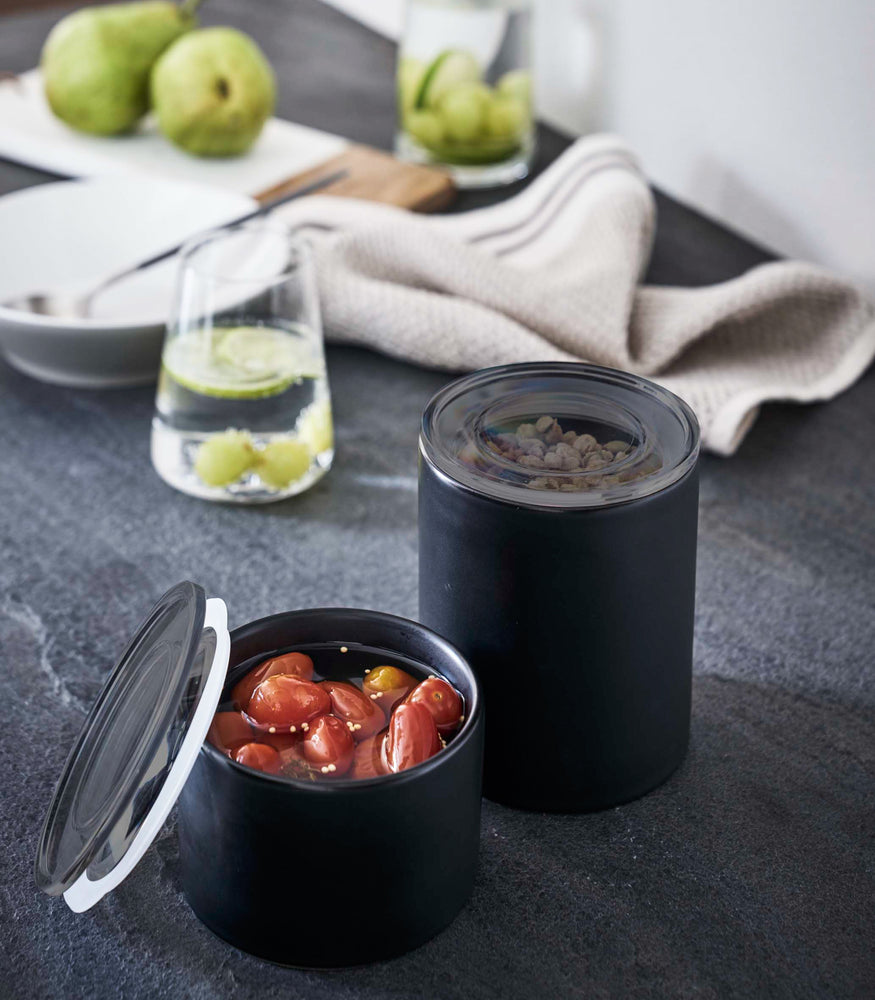 View 18 - Front view of black Ceramic Canisters containing food by Yamazaki Home.