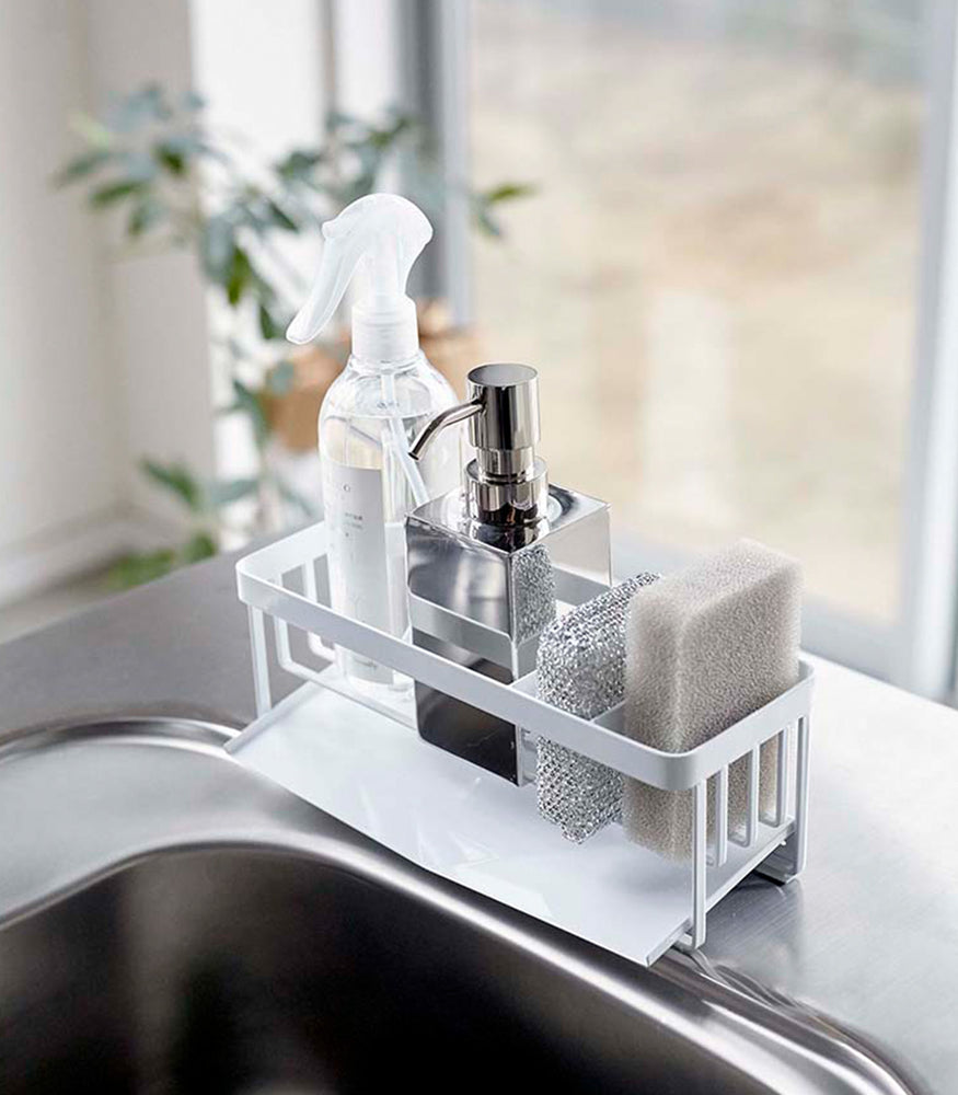 View 2 - White steel sponge and soap bottle holder with white draining tray.