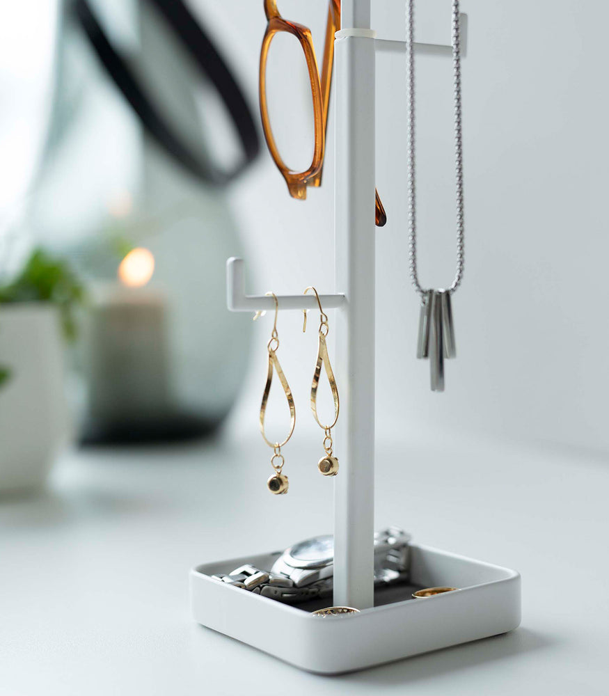 View 8 - Close up of white Yamazaki Home Tree Accessory Stand displaying earrings