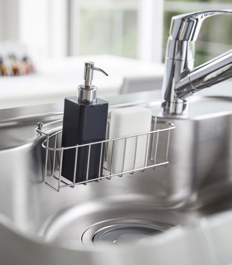 Black Hand Soap Dispenser in kitchen sink by Yamazaki Home.