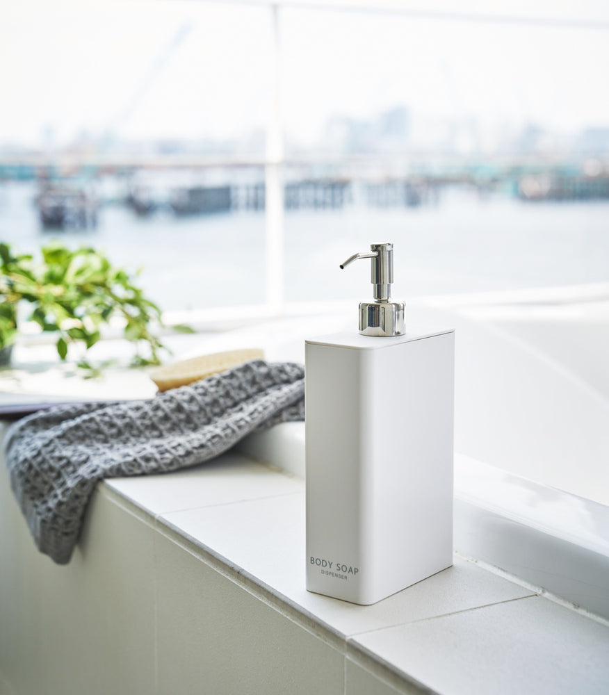 View 22 - White Body Soap Dispenser in bathroom by Yamazaki Home.