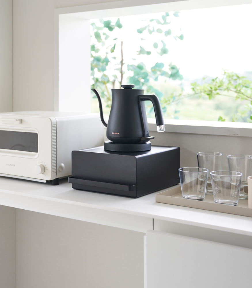 View 10 - Yamazaki Home Black Countertop Rack with Drawer with a balck kettle.