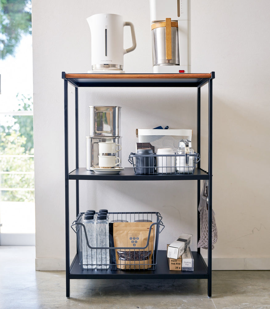 View 7 - Front view of black Storage Rack holding coffee brewing accessories by Yamazaki Home.