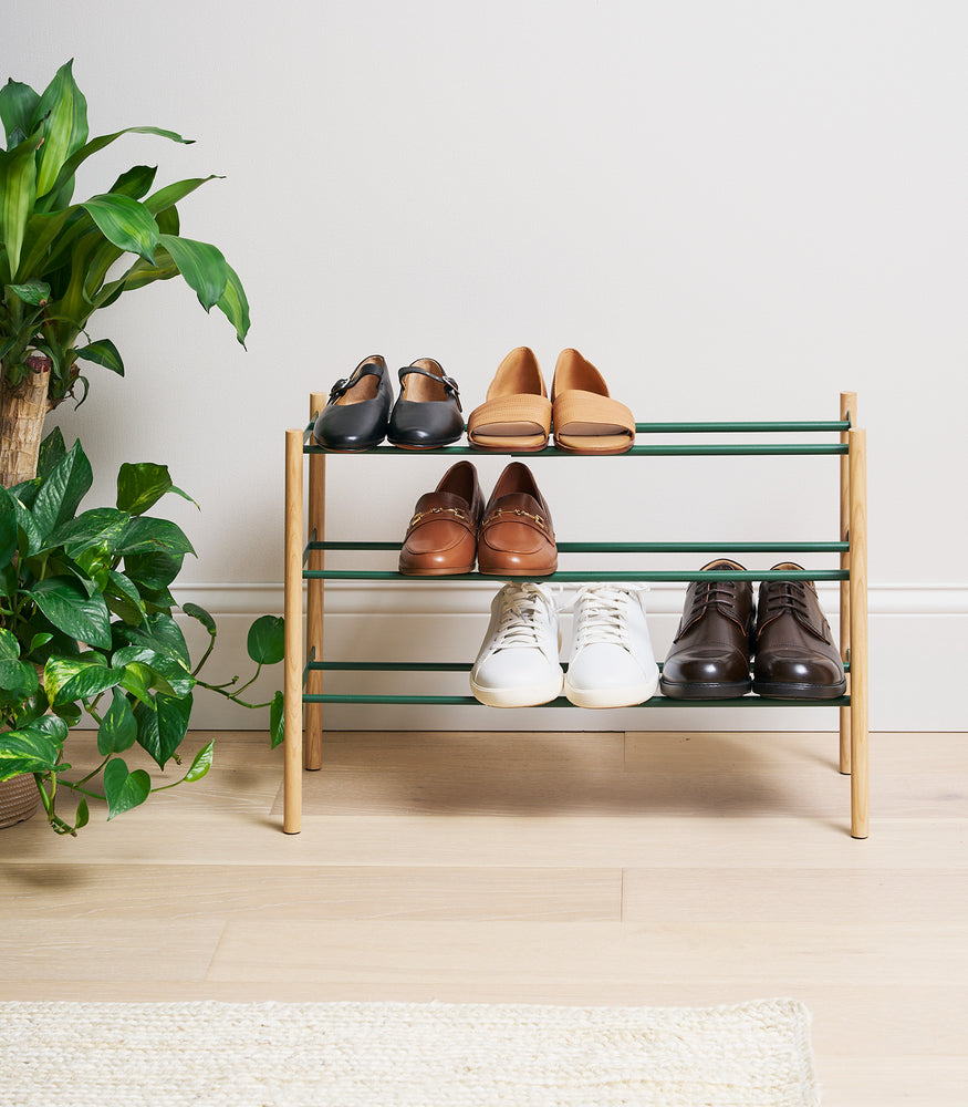 View 5 - Forest Green Yamazaki Home Expandable Shoe Rack with 5 pairs of shoes fully expanded