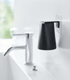 Black Yamazaki Home traceless adhesive magnetic cup installed next to sink