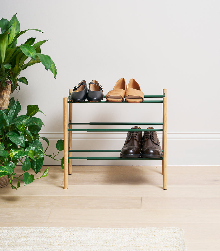 View 4 - Forest Green Yamazaki Home Expandable Shoe Rack with 3 pairs of shoes partially expanded