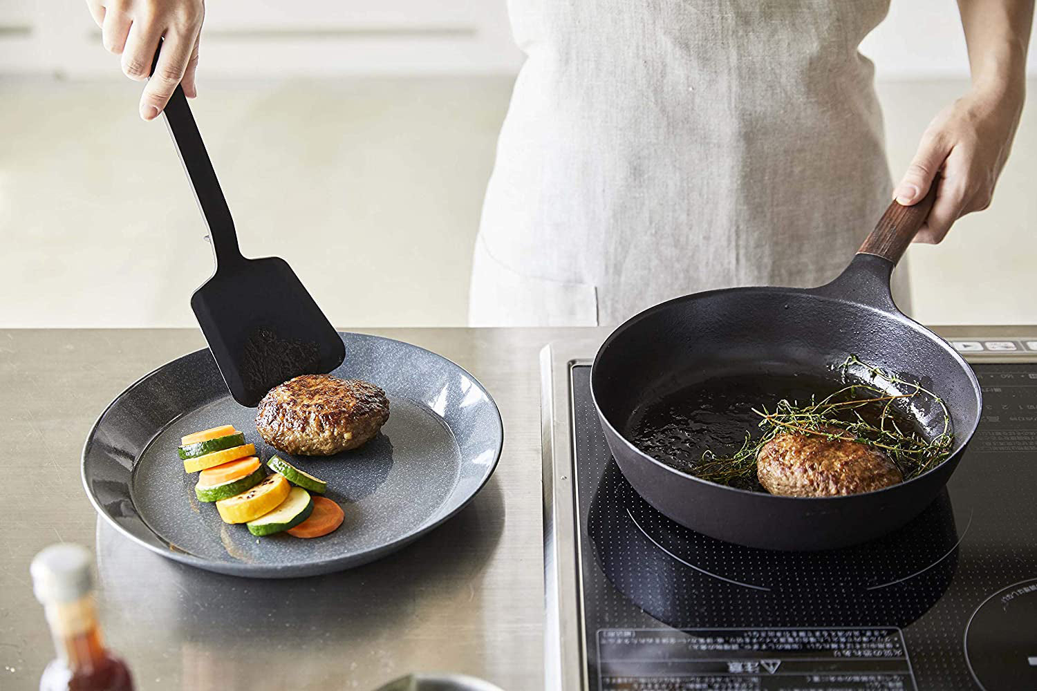 View 12 - Black Floating Spatula serving food in kitchen by Yamazaki Home.