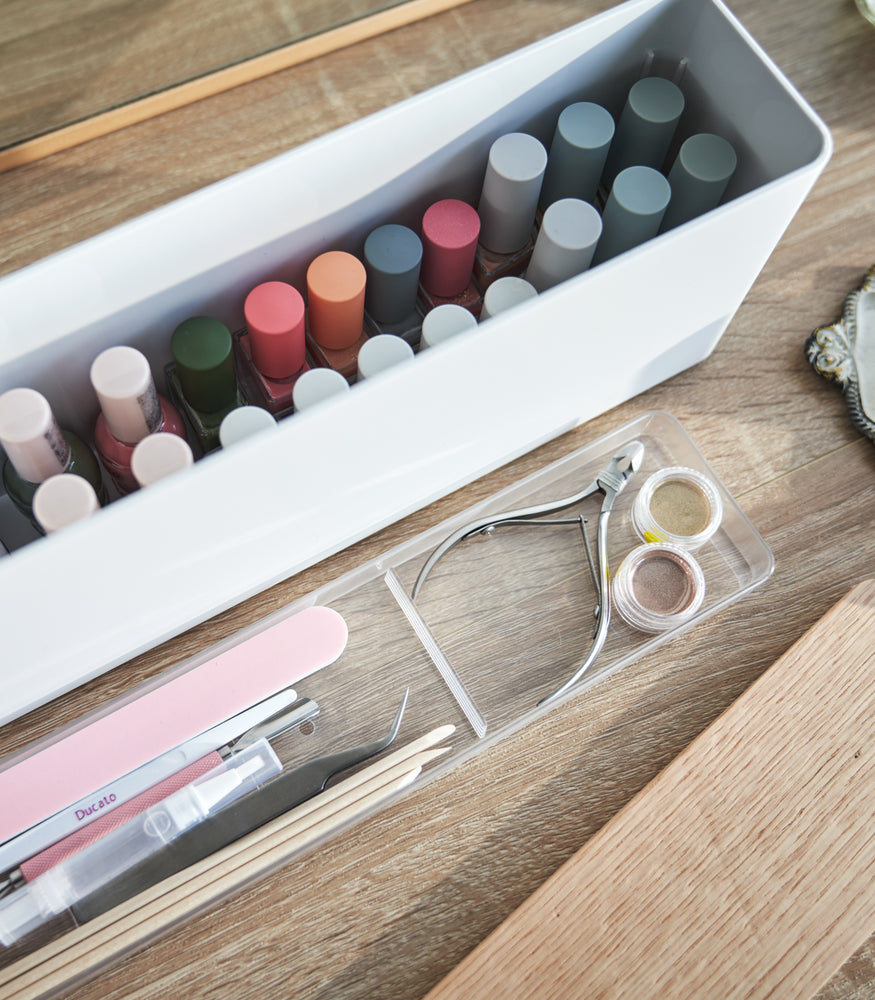 View 7 - An open Yamazaki Nail Polish Organizer with its tray removed holding nail polish.