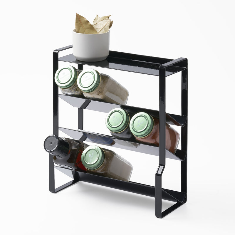 Yamazaki Home Four-Tier Slim Spice Rack with props, set against a white background.