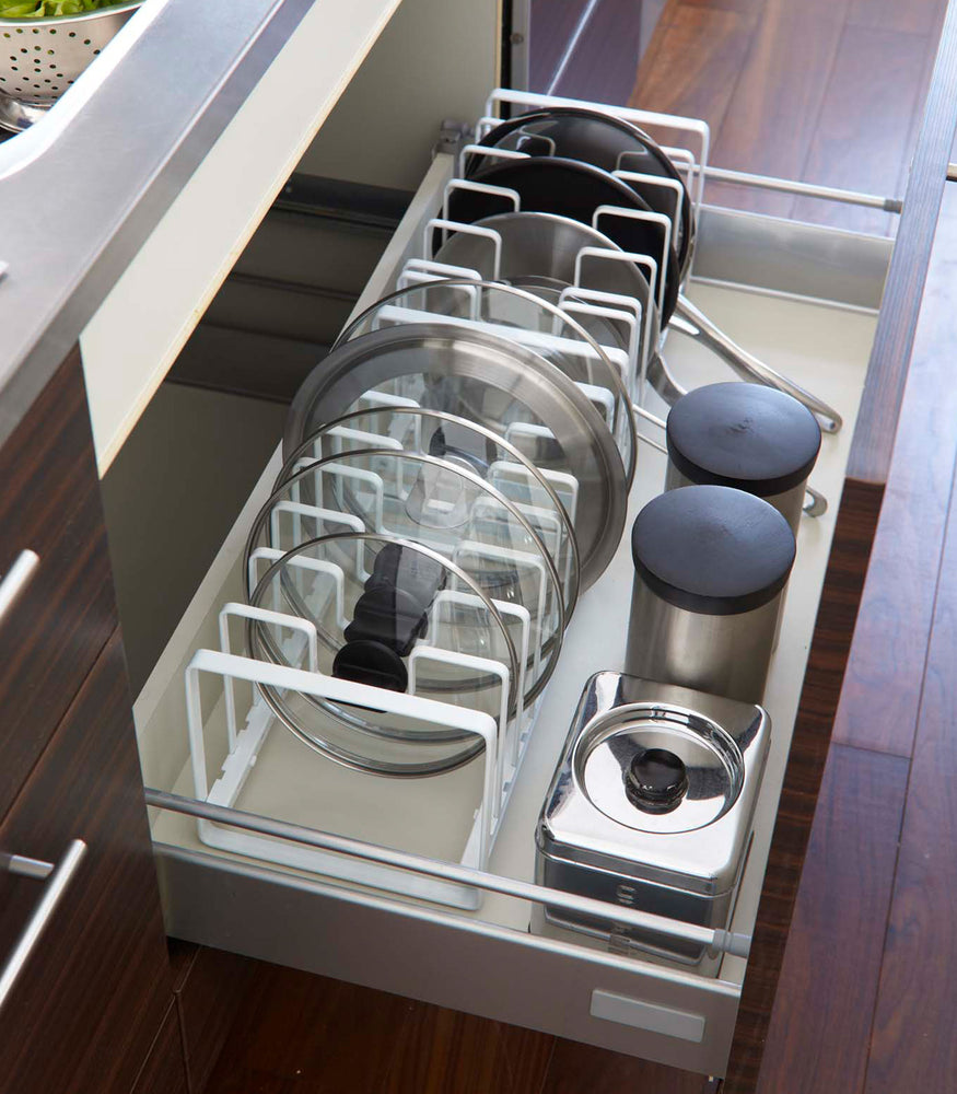 View 3 - Adjustable white steel pot lid and frying pan organizer.