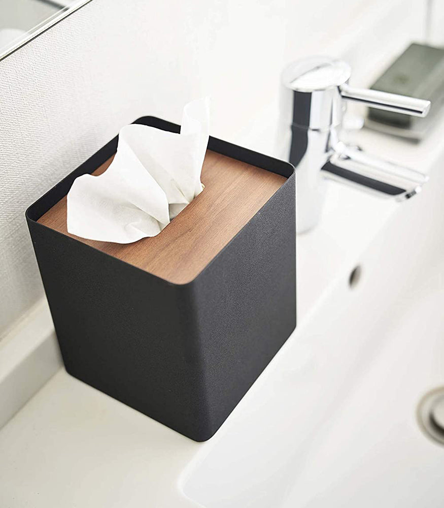 View 10 - Aerial view of black Tissue Case on sink countertop by Yamazaki Home.