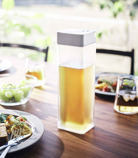 Yamazaki Horizontal Laying Water Container filled with tea on a table of food view 2