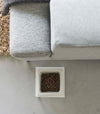 Top-down view of white tall Yamazaki Single Pet Food Bowl filled with food