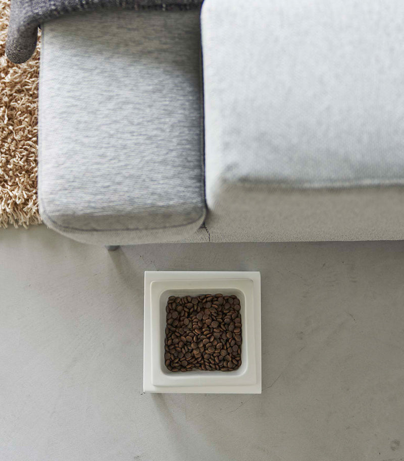 Top-down view of white tall Yamazaki Single Pet Food Bowl filled with food