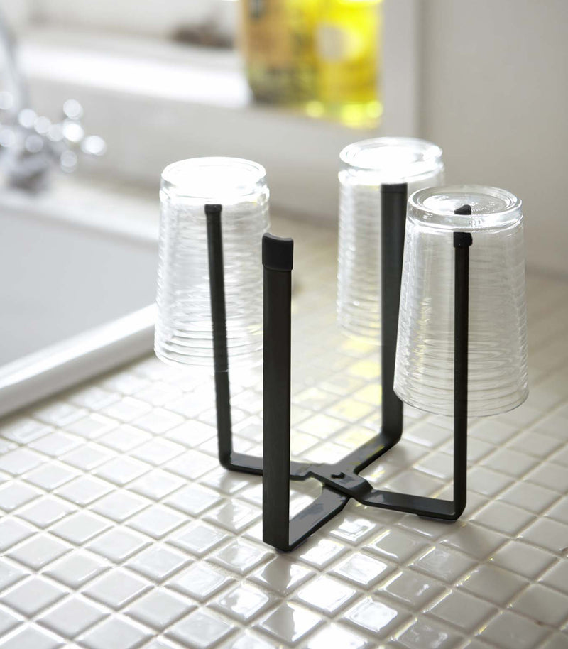 Small black Yamazaki Collapsible Bottle Dryer with glasses drying