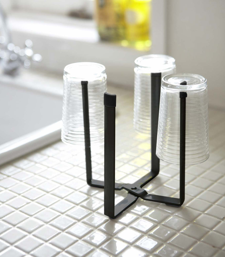 View 8 - Small black Yamazaki Collapsible Bottle Dryer with glasses drying
