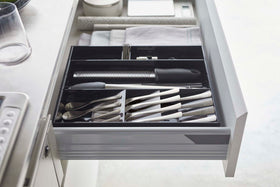 Side view of black Expandable Cutlery Storage Organizer by Yamazaki Home. view 24