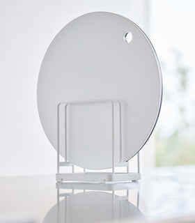 White Yamazaki Round Cutting Board Stand with a round cutting board view 3