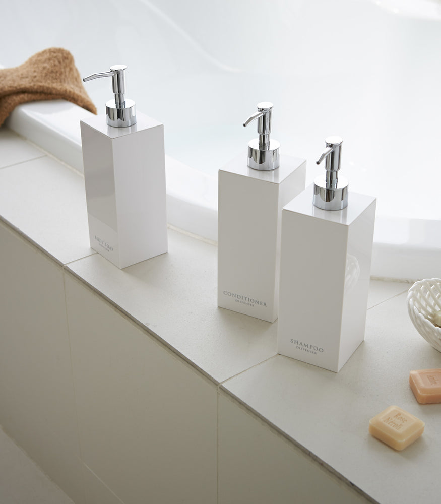 View 11 - White Yamazaki Home square soap dispenser in three styles by bathtub