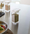 White Yamazaki Home Spice Jar opened with the slotted side