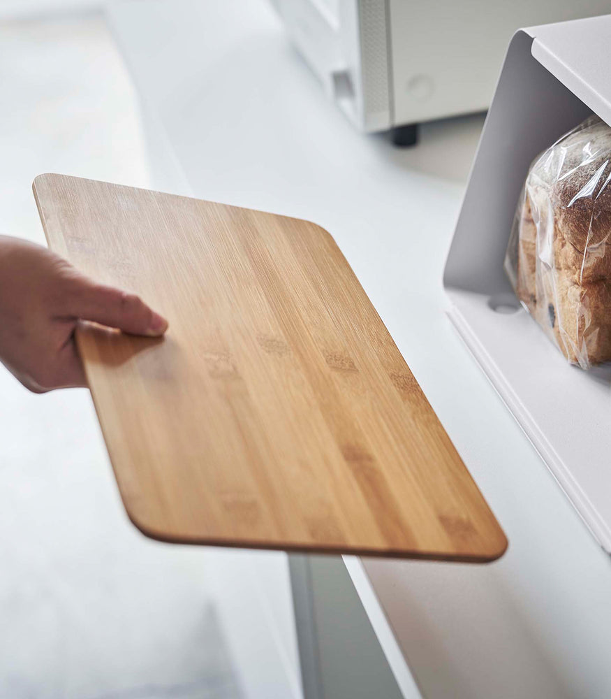 View 7 - Cutting board lid taken off of white Yamazaki Bread Box with Cutting Board Lid