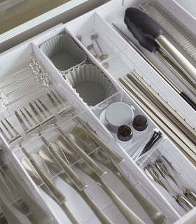 Aerial view of white Expandable Cutlery Storage Organizer holding utensils by Yamazaki Home. view 18