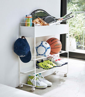 White Yamazaki Entryway Organizer with shoes and sports equipment on it view 4