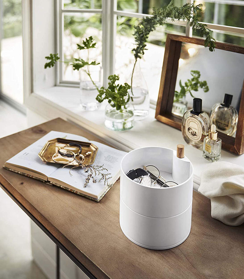 White Stacked Jewelry Box holding glasses and watch on vanity by Yamazaki Home.
