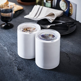 Front view of white Ceramic Canisters holding granola and chocolate by Yamazaki Home. view 12