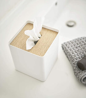 Aerial view of white Tissue Case on sink counter by Yamazaki Home. view 5