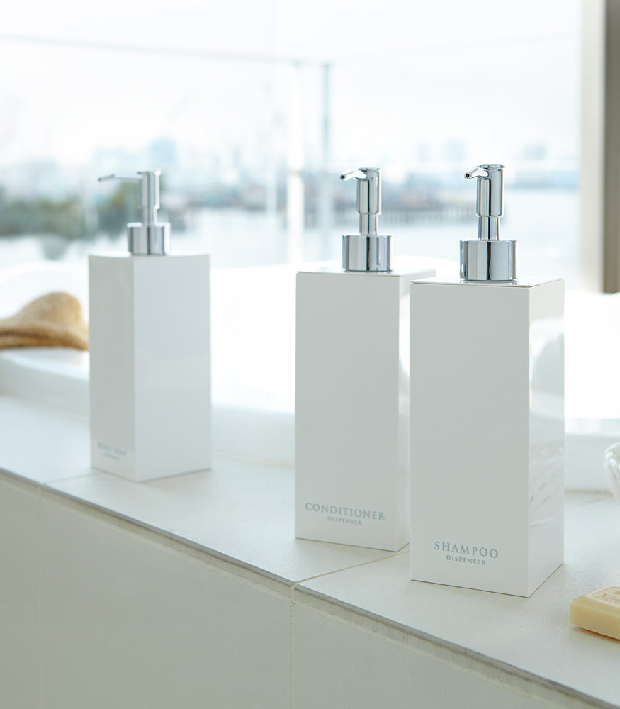 View 3 - White Yamazaki Home soap dispenser in three styles by bathtub