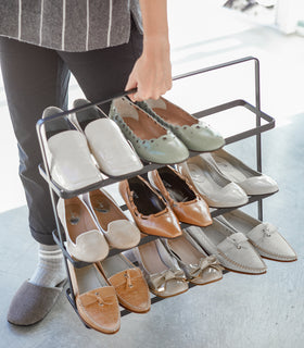 Front view of black Shoe Rack holding shoes by Yamazaki home. view 8