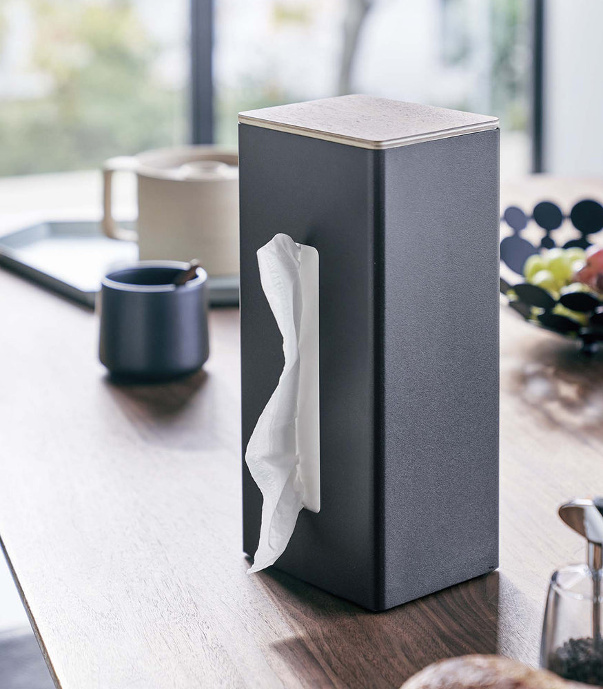View 10 - Black Yamazaki Two-Sided Tissue Case on a kitchen table
