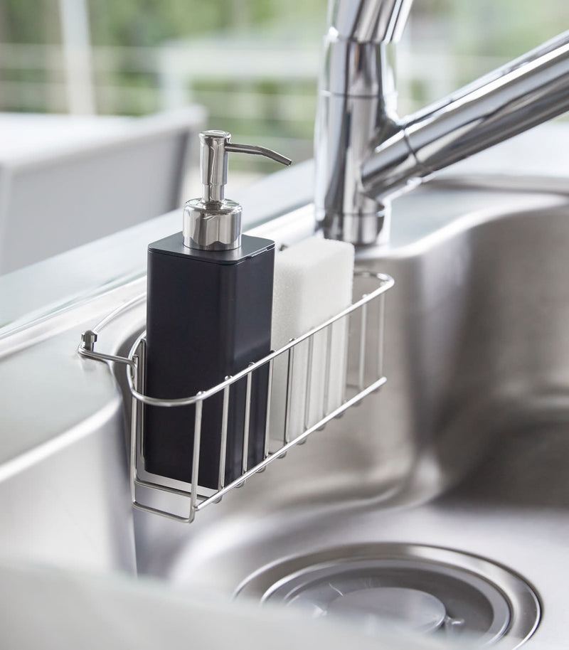 Side view of black Hand Soap Dispenser in kitchen sink by Yamazaki Home.